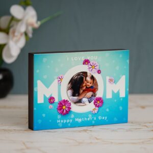 It is the best gift this mother's. A cute table photo frame for your mom. Select few of this best pics, and our artist will create a collage, as in the display picture.