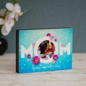 It is the best gift this mother's. A cute table photo frame for your mom. Select few of this best pics, and our artist will create a collage, as in the display picture.