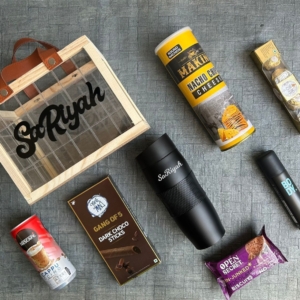 Give a lovely touch to your gifting by sending this amazing combo to your love on his occasion. Premium Hamper Includes a Fancy acrylic Basket, Name on acrylic basket, New Travel mug, Nescafé Cold CoffeeSet of 5 Gone mad sticks, Open secret cookies, Miniso Body spray a set of 4 Ferraro Rocher and Makino Nachos.