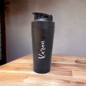 Personalized Gym shaker with name 750ml made with stainless steel in black color. Best for gifting and personal use. This bottle is fully customizable any name or any text can be added. It's flask technology keeps water hot and cold for upto 6 Hours.