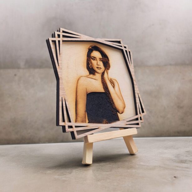 Custom 3D wood carved poster displayed in a personalized engraved wooden photo frame with a sturdy wooden stand, showcasing natural wood grain texture and unique design