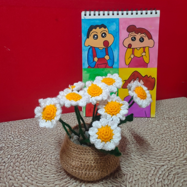 Custom crochet flower pot featuring handmade daisy flowers, with an option to customize with sunflowers or roses, displayed in a rustic pot.