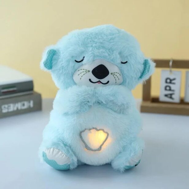 Soft Breathing Teddy plush toy with a heart-shaped glowing light, perfect for bedtime comfort and relaxation for kids.