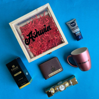 Give a lovely touch to your gifting by sending this amazing combo to your love on his birthday. It has a Wooden acrylic box, Name on box, Saffiona men wallet, Bistro Mug, Fogg Perfume, a set of 4 Ferraro chocolate and Nivea Facewash.