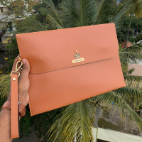 A laptop sleeve is a protective and stylish case designed specifically to hold and safeguard a laptop. It is typically made of durable materials such as Faux Leather.