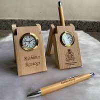 The personalized wooden pen stand with clock and wooden pen is a stylish and functional addition to any desk or office space. Handcrafted with precision and attention to detail, this set features a wooden pen stand that holds your favorite pen securely and includes a built-in clock for added convenience.