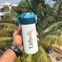 Personalized stainless steel U Cup Kids Sipper water bottle with name 350 ml available in only cream color. Best for gifting and personal use for kids. This bottle is fully customizable any name or any text can be added.