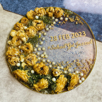 Round resin rose preservation refers to a decorative item that features real rose preserved in resin, encased in a round shape. The resin preserves the natural beauty of the rose and creates a unique and lasting display piece that can be used as a home decor item or a gift for a loved one. 